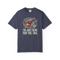 Load image into Gallery viewer, Navy blue t-shirt with a graphic of a lobster and text 'I'm just here for the tail' on a white background