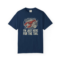 Load image into Gallery viewer, Navy blue t-shirt with a graphic of a lobster and text 'I'm just here for the tail' on a white background