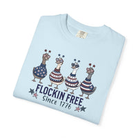 Load image into Gallery viewer, Folded Chambray blue t-shirt with patriotic duck design and text on a white background