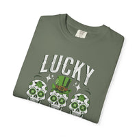 Load image into Gallery viewer, Folded Moss green t-shirt with 'LUCKY' text and skull designs on a white background