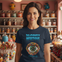 Load image into Gallery viewer, Woman wearing a Navy t-shirt with colorful design and text in a candy store setting